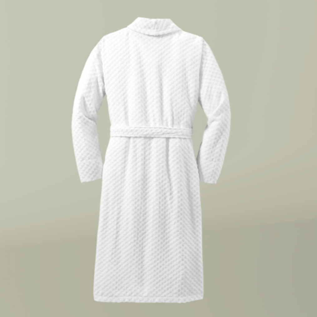 White textured bathrobe on a beige background