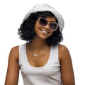 Front view of Le Bel Hotel signature reversible bucket hat in premium travel fabric.