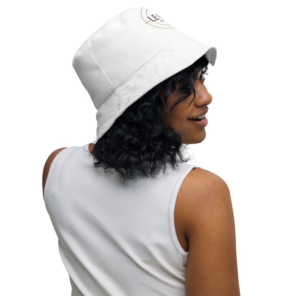 Lifestyle mockup of Le Bel Hotel reversible bucket hat styled for luxury travel and poolside wear.