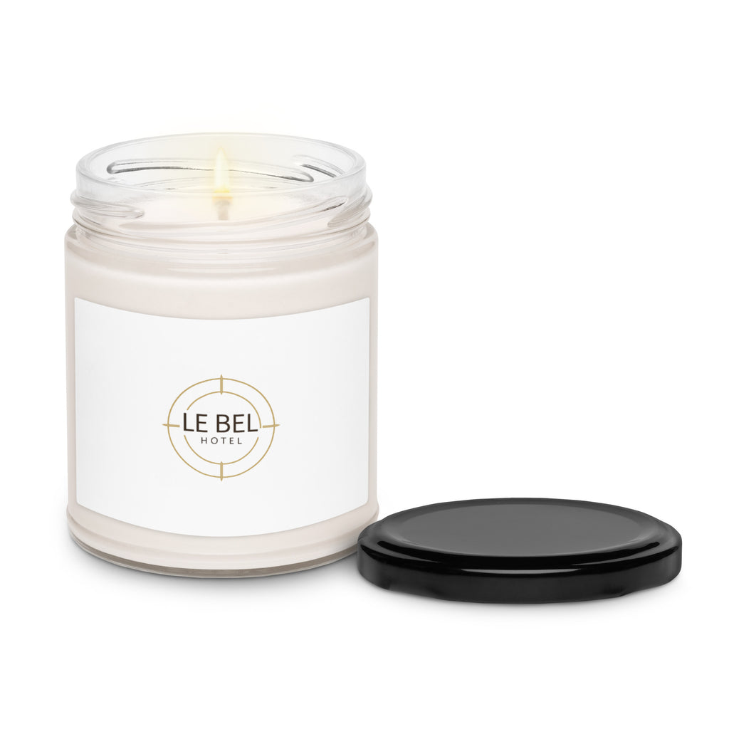 Le Bell Collection minimalist white soy candle in a clear glass jar with black metal lid.